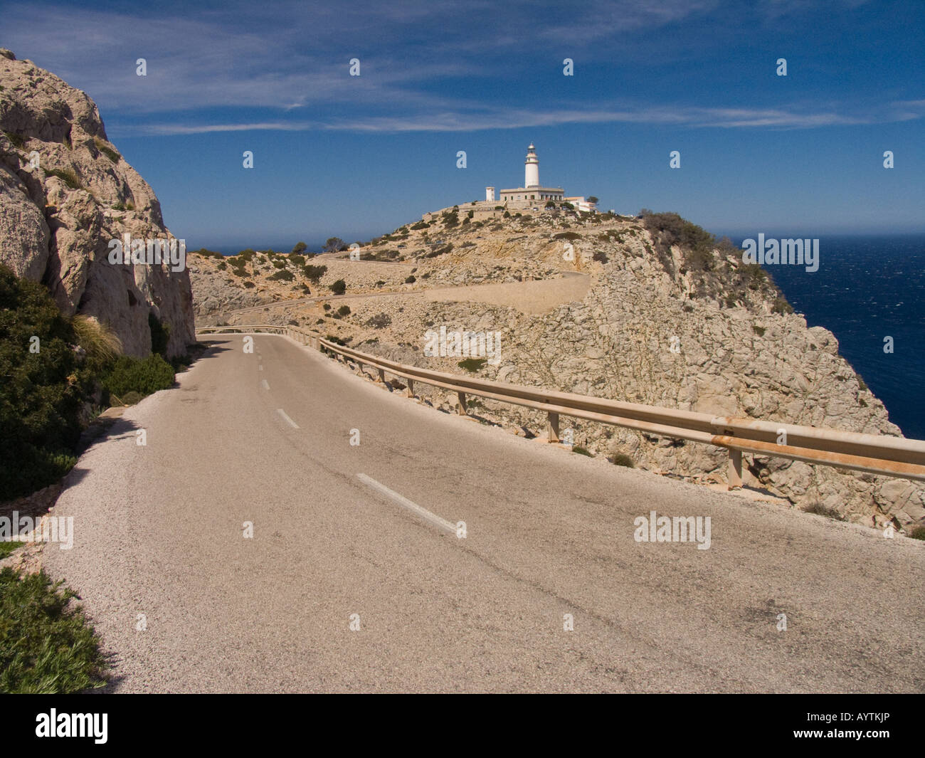 Mountain road leading to lighthouse Stock Photo