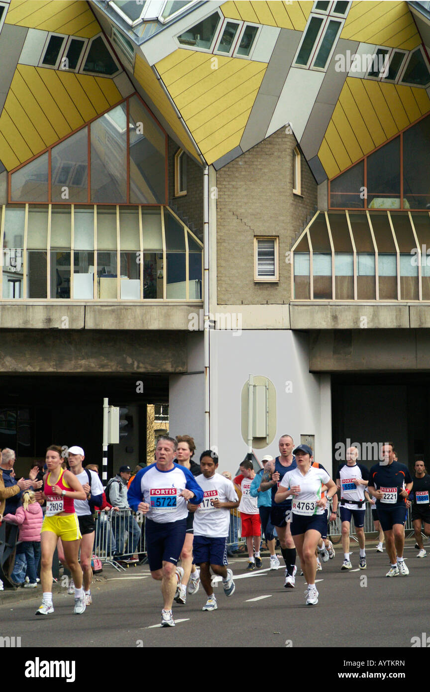 Group of runers at Rotterdam street City Marathon 13th April 2008, Netherlands, with Blaak street cubic houses architecture Stock Photo