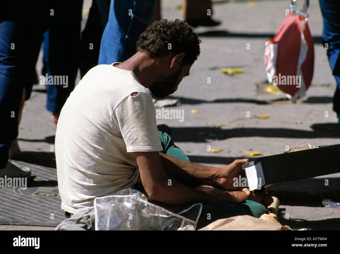 Brazil, BR-Belo Horizonte, Minas Gerais, beggar sitting at the roadside Stock Photo
