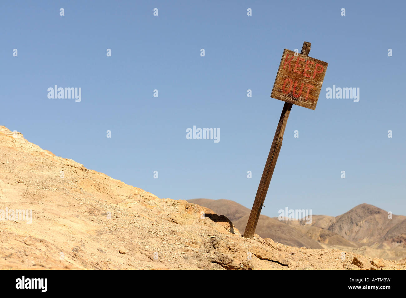 An old keep out sign in the desert Stock Photo