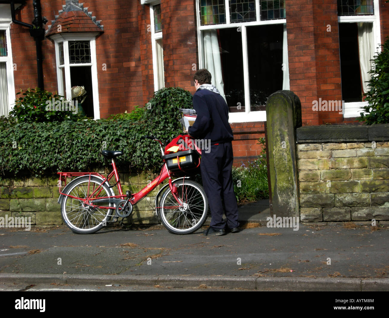 postman delivering mail Stock Photo Alamy