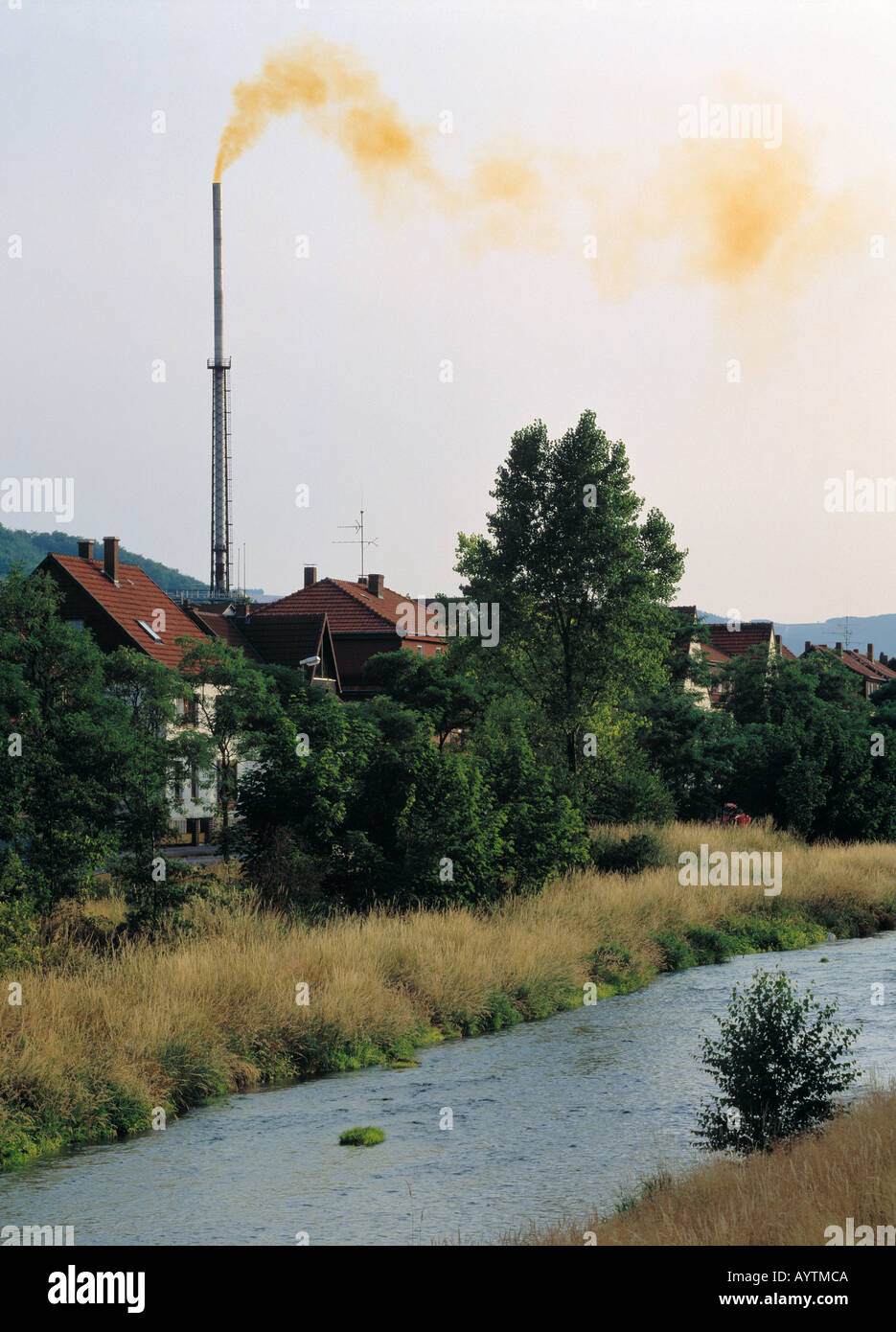 waste, stack, sulphur, environment, industry, factory, pollution, chimney, smoke, exhaust fumes, smokestack, river, brook, D-Langelsheim, Harz, Lower Saxony Stock Photo