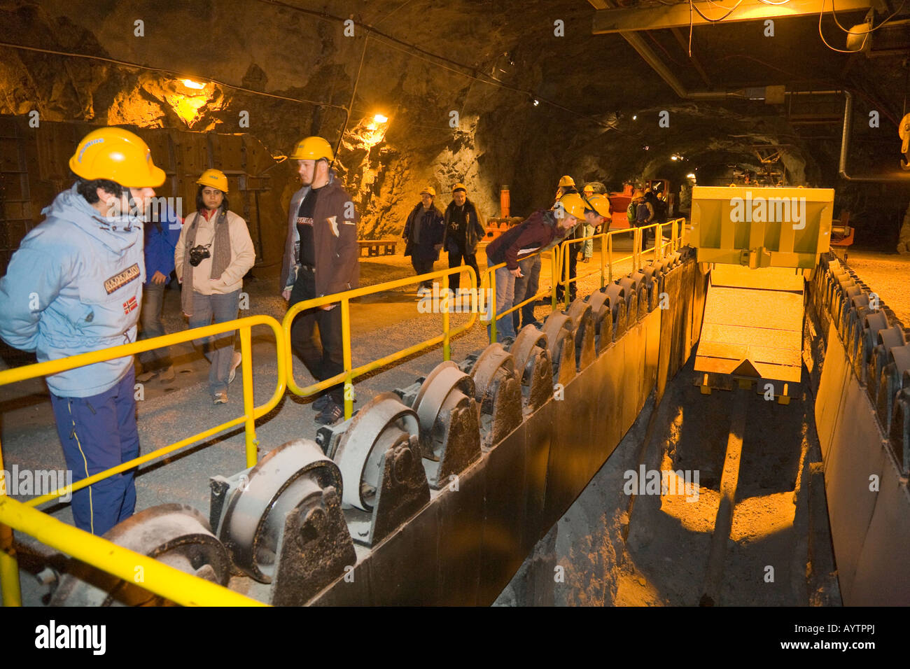 Visitors looking at a discharging station in the LKAB InfoMine of the LKAB iron ore mine in Kiruna/Sweden Stock Photo