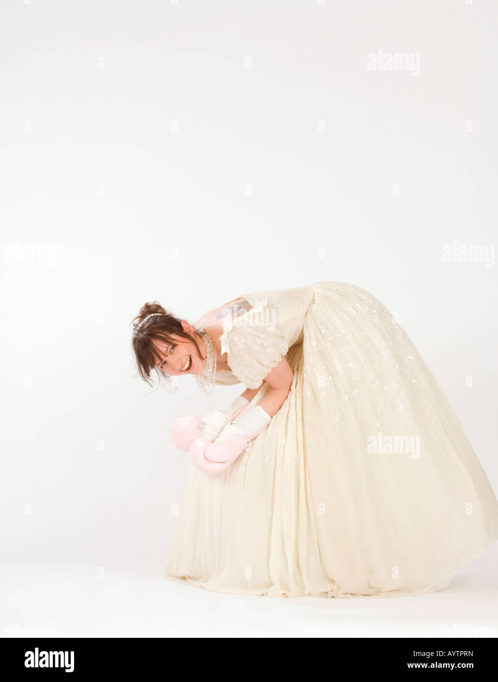 A bride wears pink boxing gloves in a light-hearted look at prenuptial agreements and getting married. Picture by JIm Holden. Stock Photo