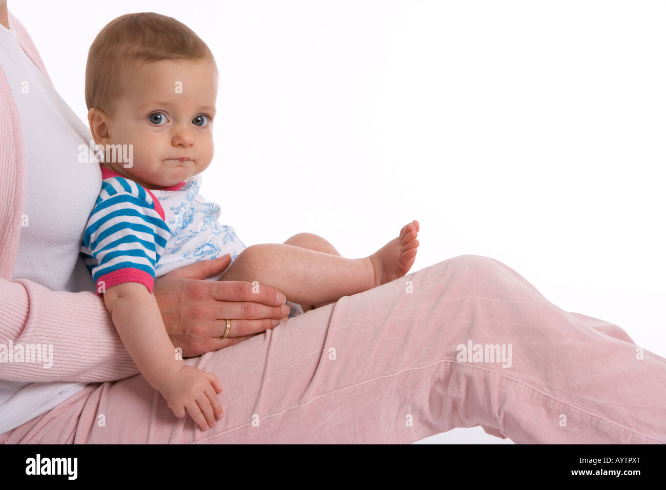 Baby sitting on her mothers lap Stock Photo Alamy