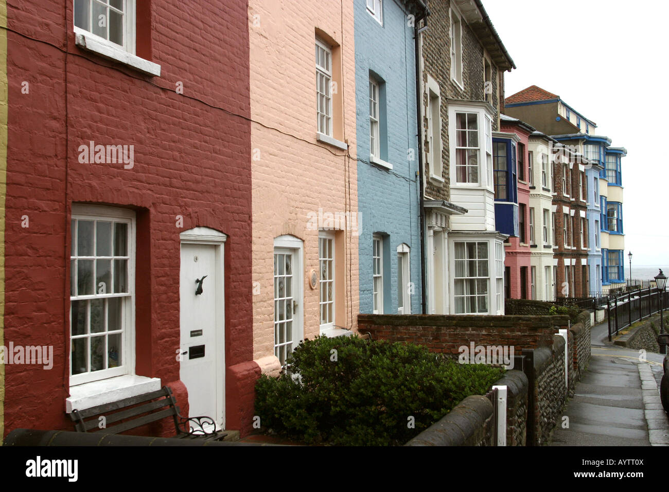 Norfolk Cromer pastel coloured houses in The Gangway Stock Photo Alamy