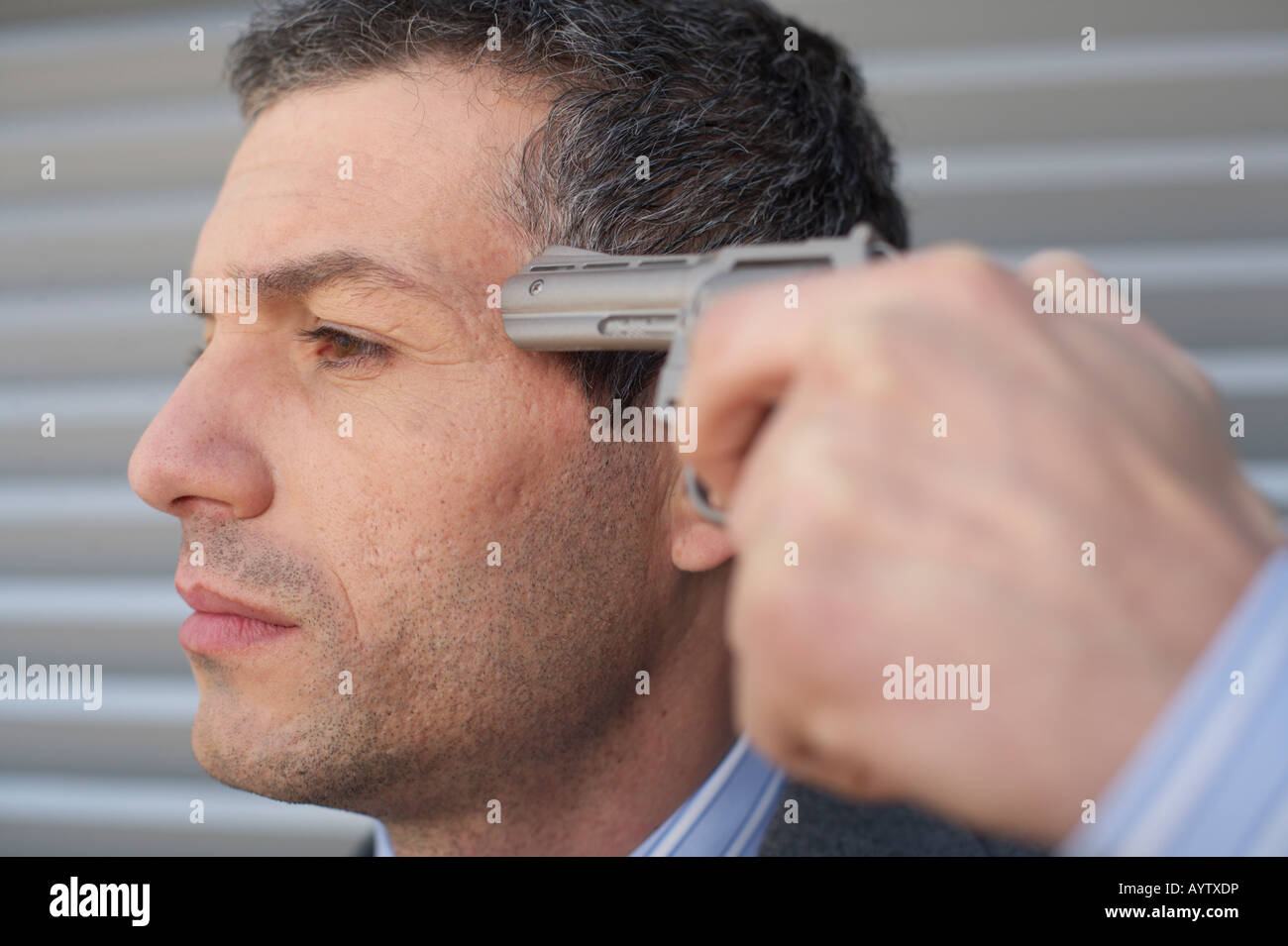 Businessman holding a gun to head Stock Photo Alamy