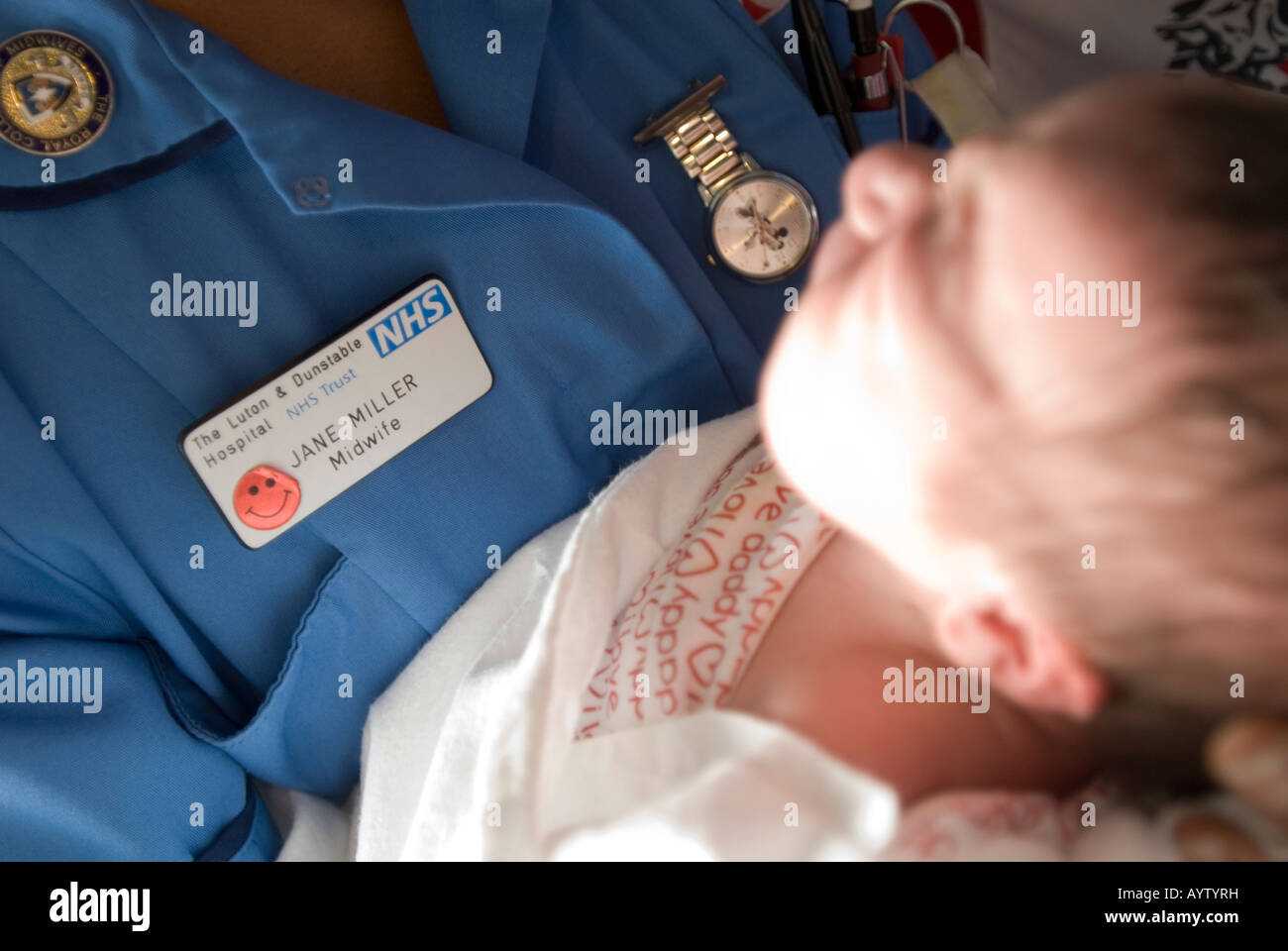 Midwife with new born baby Stock Photo