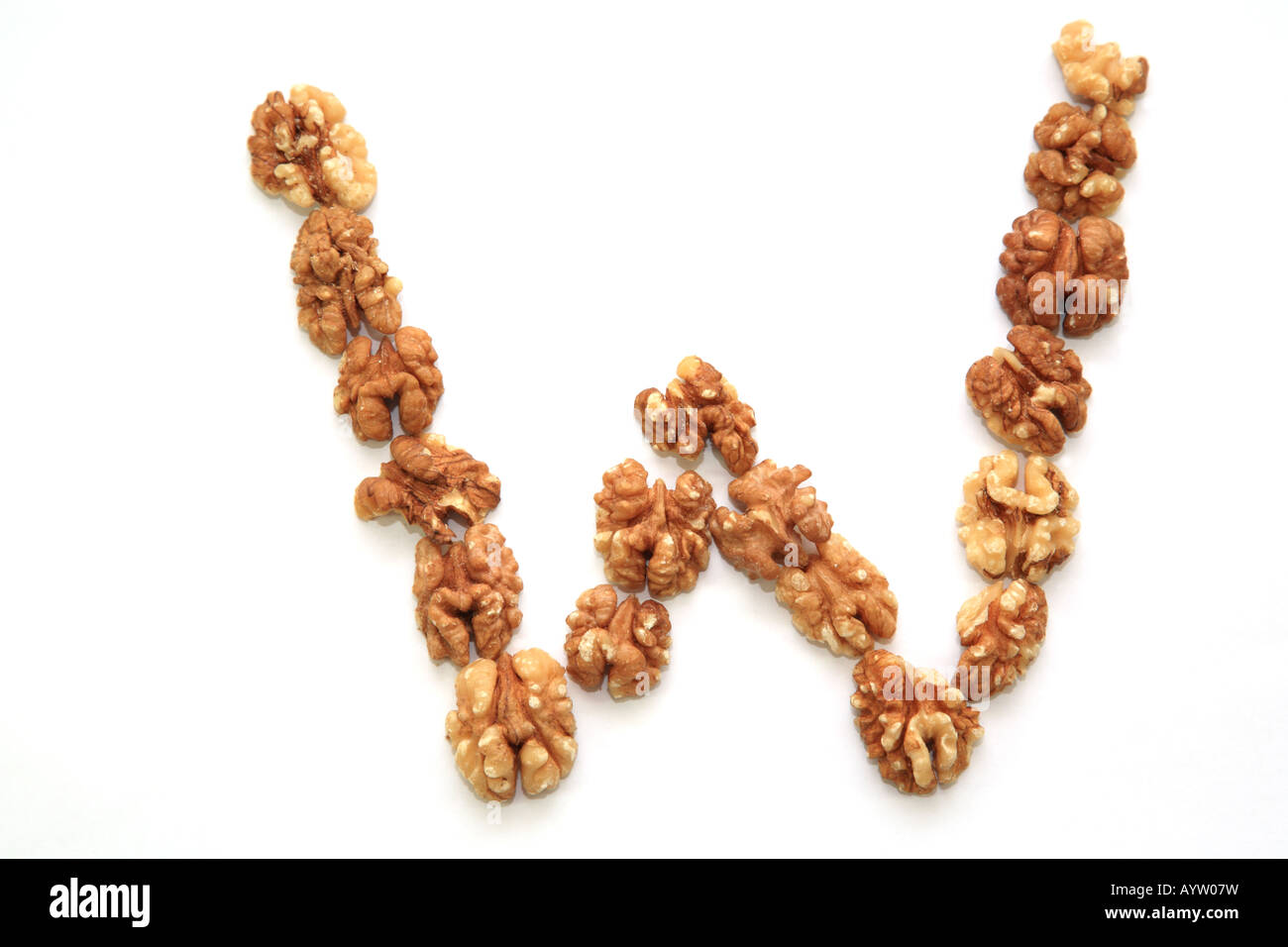 The letter W made up from walnuts Stock Photo