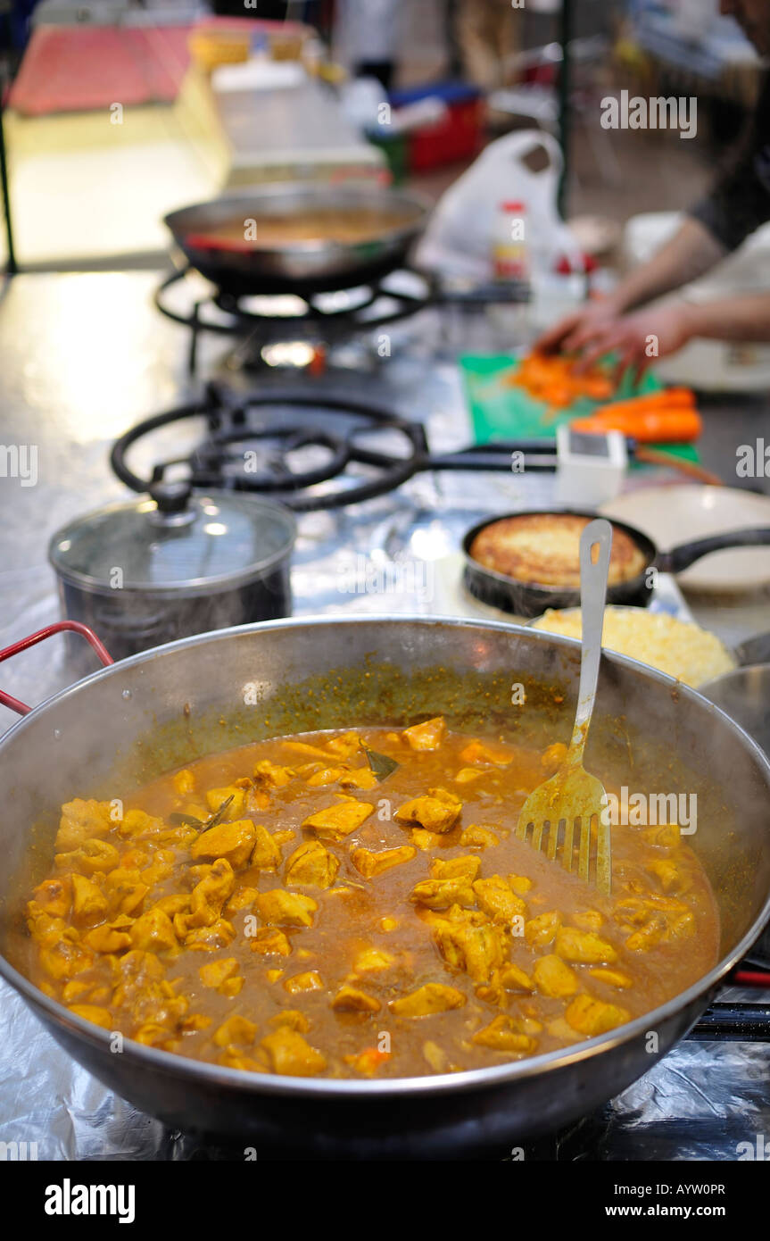 Chicken curry being prepared at a food market Stock Photo