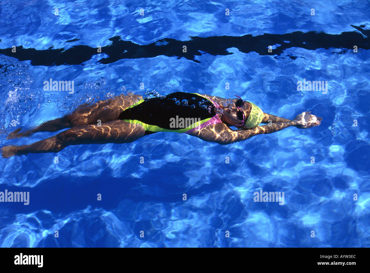 Young woman swimming backstroke hi-res stock photography and images - Alamy