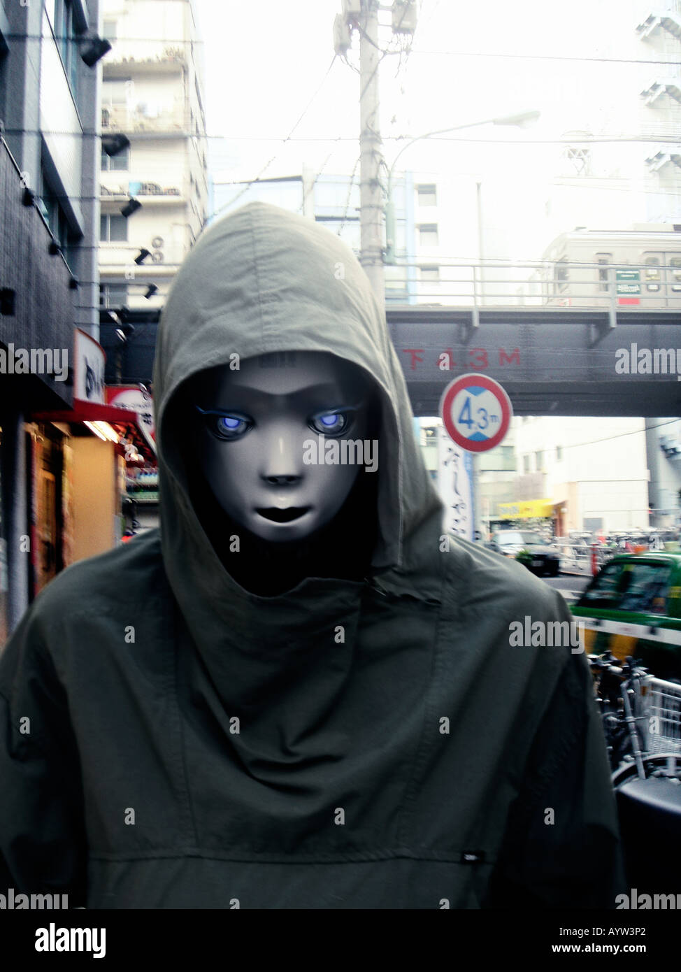 Robot wearing a hooded anorak in an urban environment Stock Photo