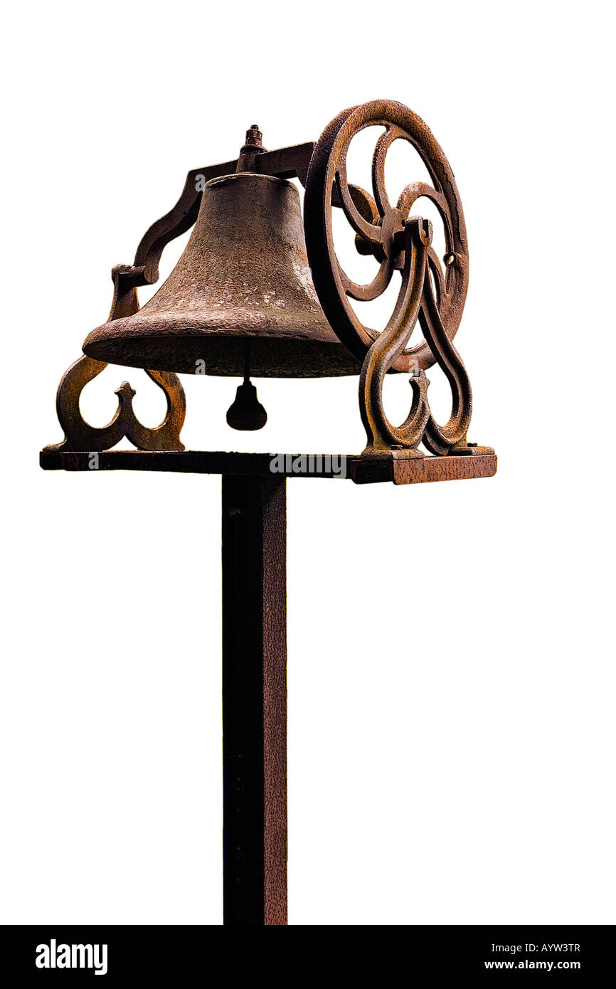 Image of a rusted cast iron steeple bell on a stand cut out against a white background Silhouette cutout Stock Photo