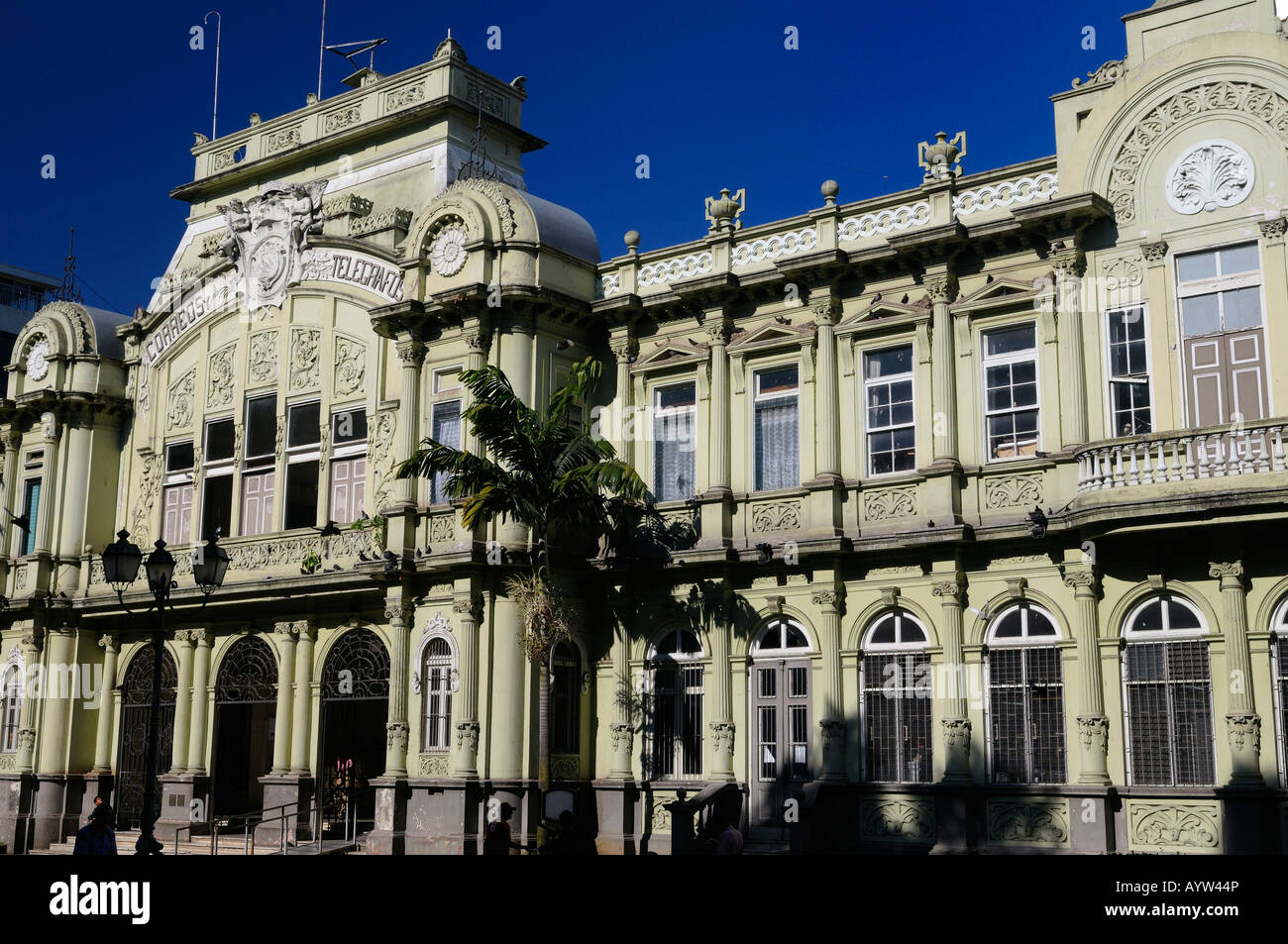 Corinthian Pilasters of Main post office building Correos Central in San Jose with morning sun and blue sky Costa Rica Stock Photo