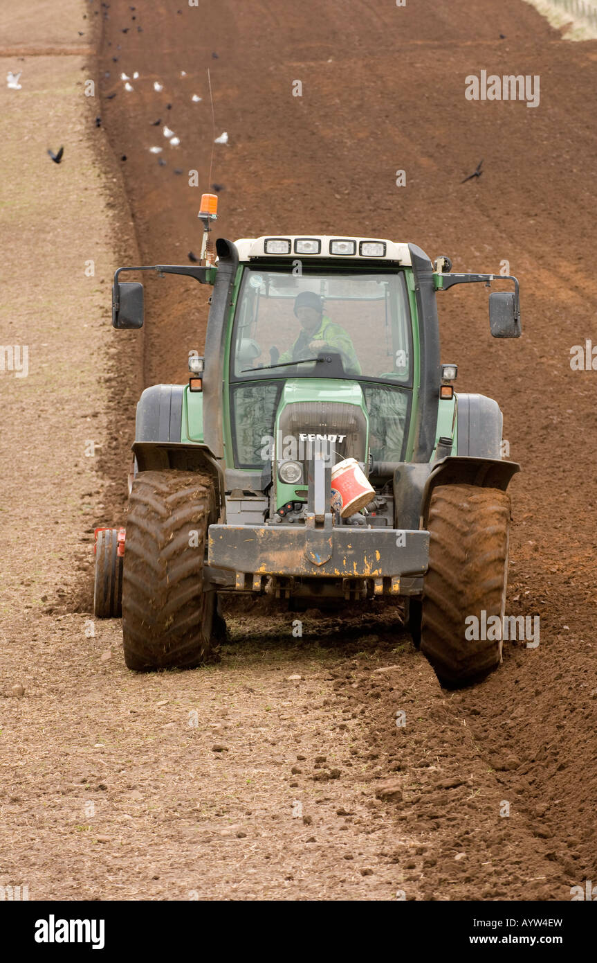 Fendt tractor ploughing with a reversible plough in preparation for