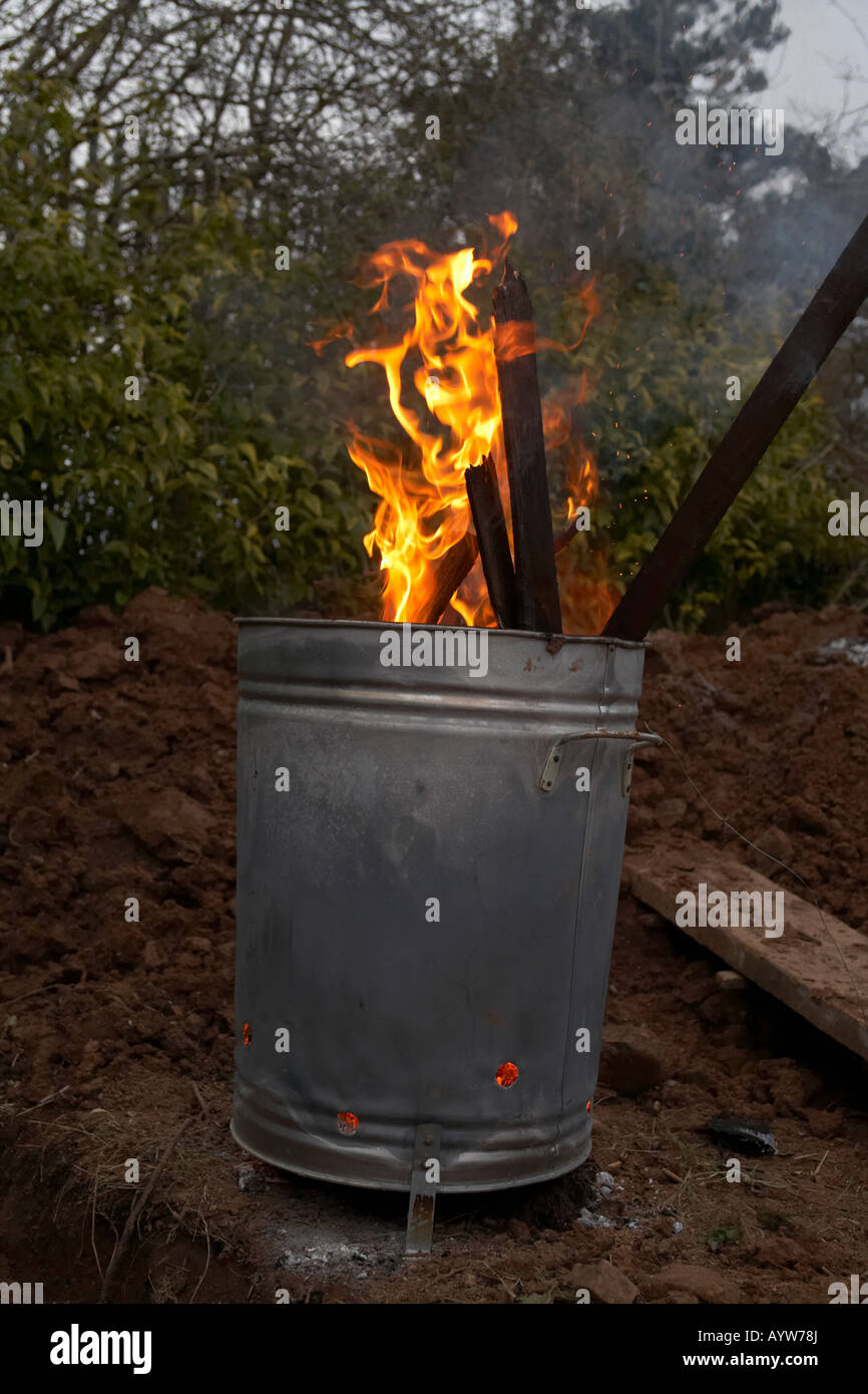 https://c8.alamy.com/comp/AYW78J/garden-incinerator-burning-household-and-garden-wooden-waste-and-branches-AYW78J.jpg