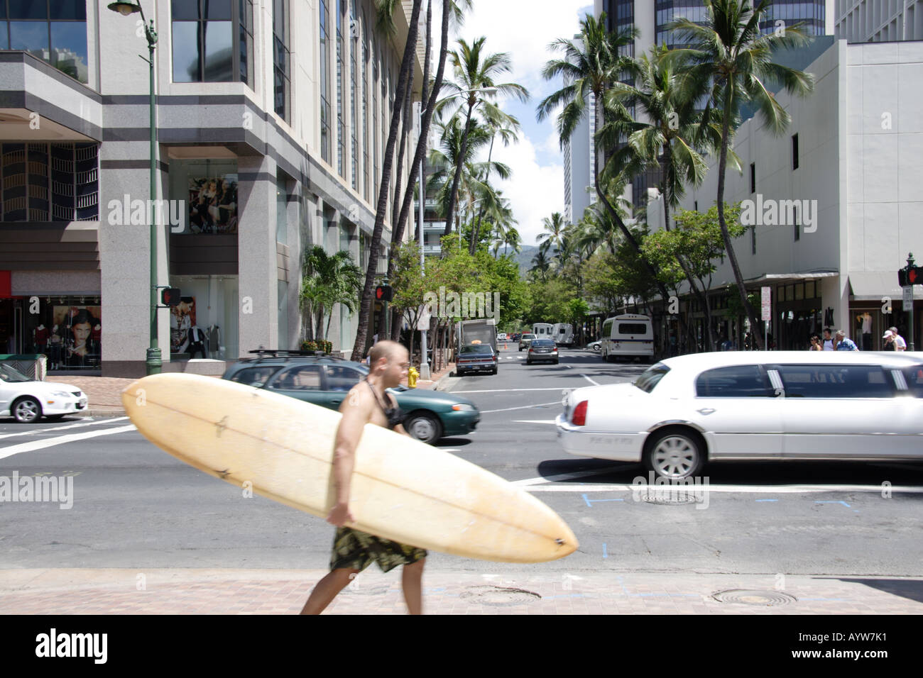 Surfer walking in Waikiki Stock Photo