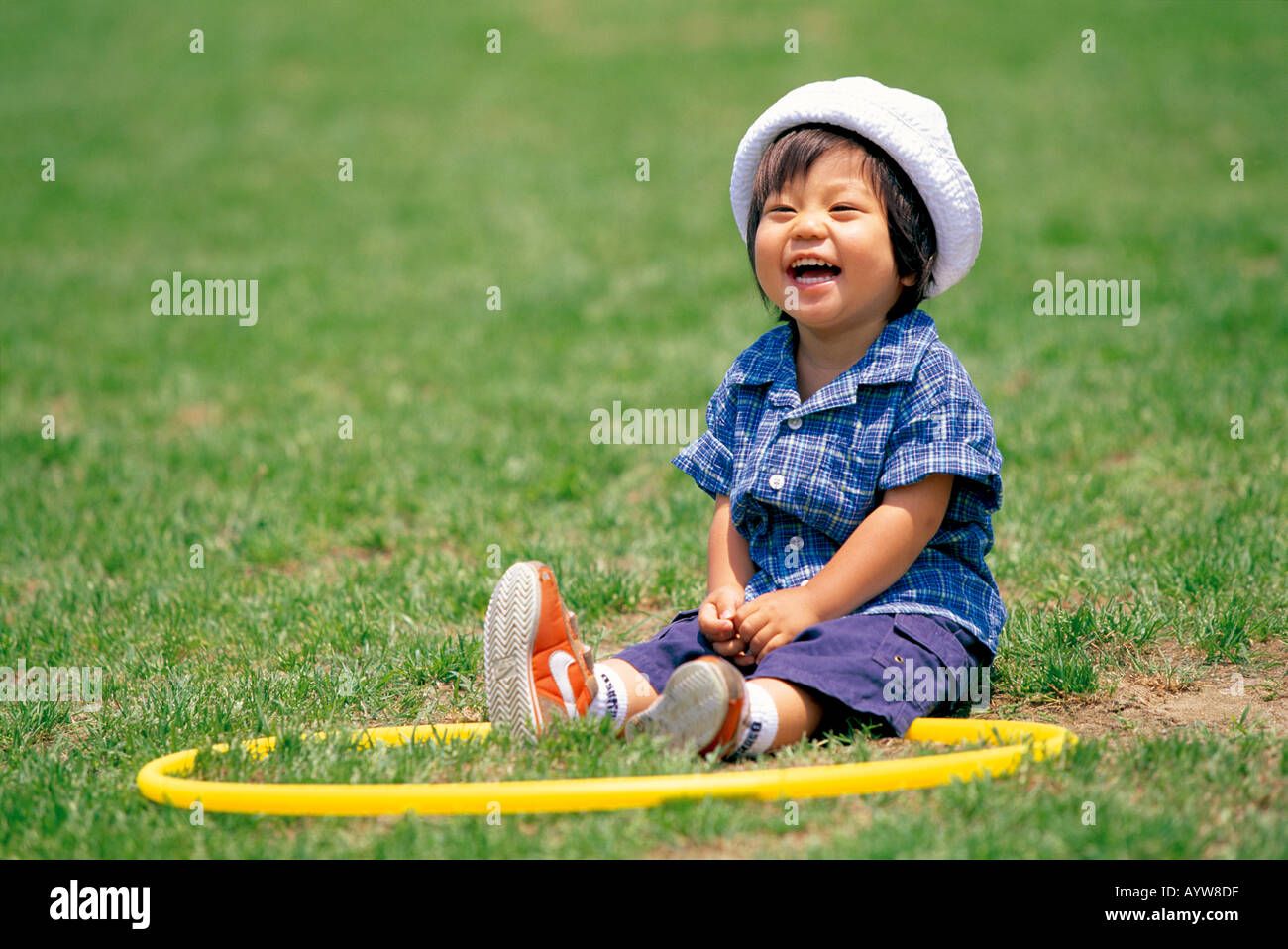 A little girl with a hoop Stock Photo