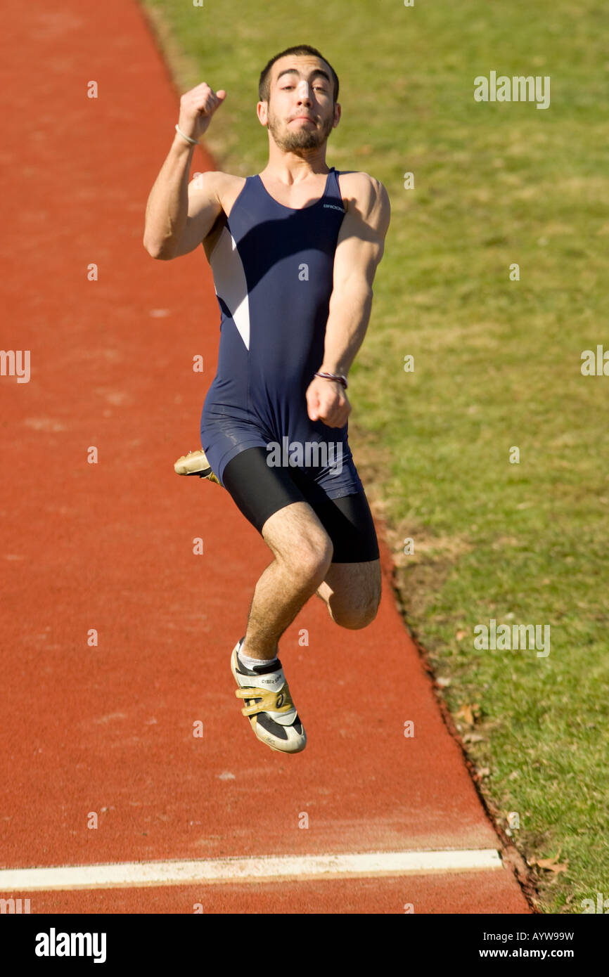 Athlete performs long jump Stock Photo Alamy