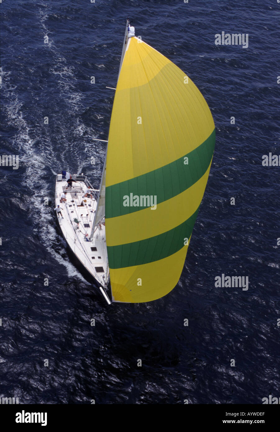 Racing sailboat approaching under spinnaker Aerial view Stock Photo