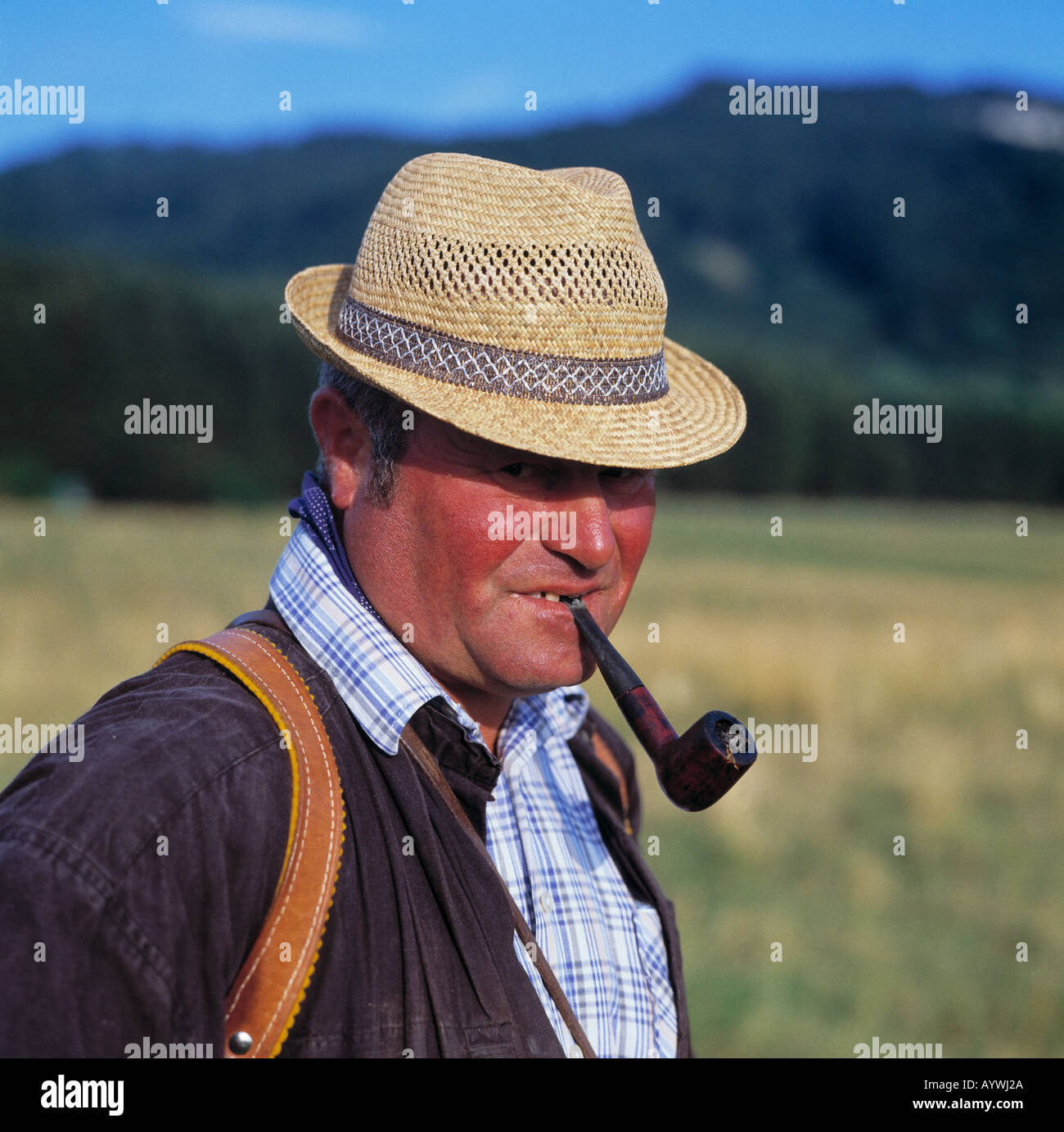 man with straw hat and pipe, smoking, pipe smoker, red dened face, health, shepherd, Swabian Jura, Baden-Wuerttemberg Stock Photo