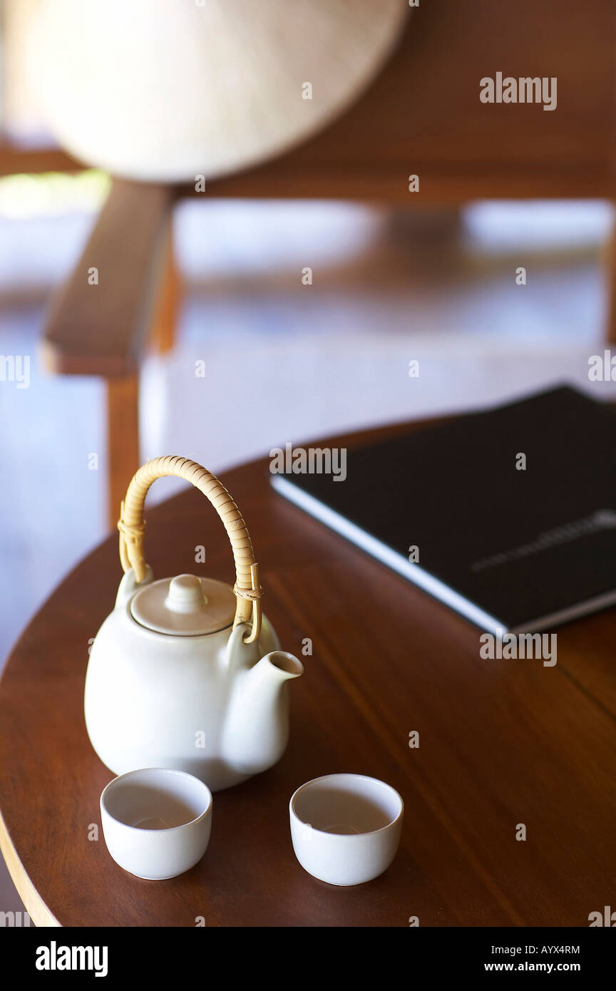 teapot and teacup on the table Stock Photo