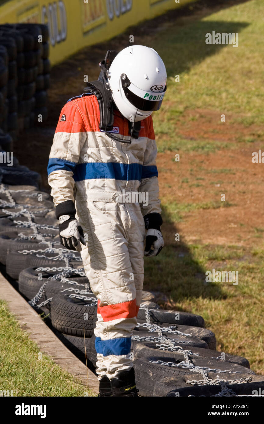 A racing car driver in his driving clothing Stock Photo Alamy