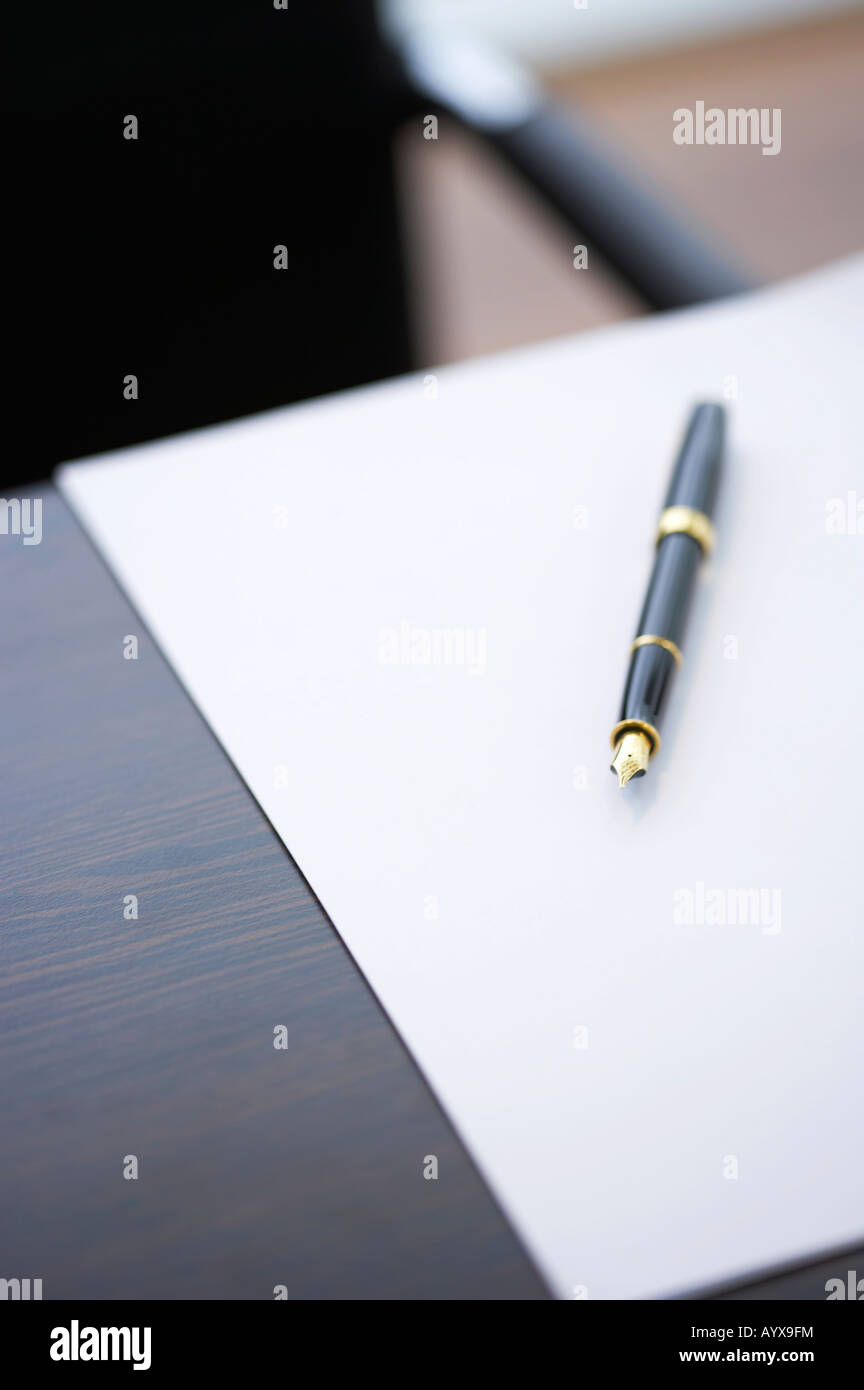 white paper and fountain pen on the desk Stock Photo - Alamy