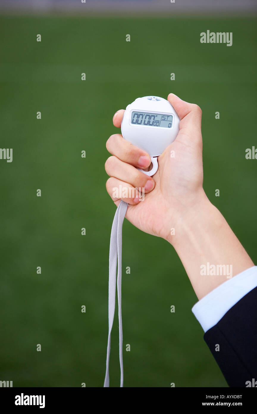stop watch raised with a hand Stock Photo Alamy