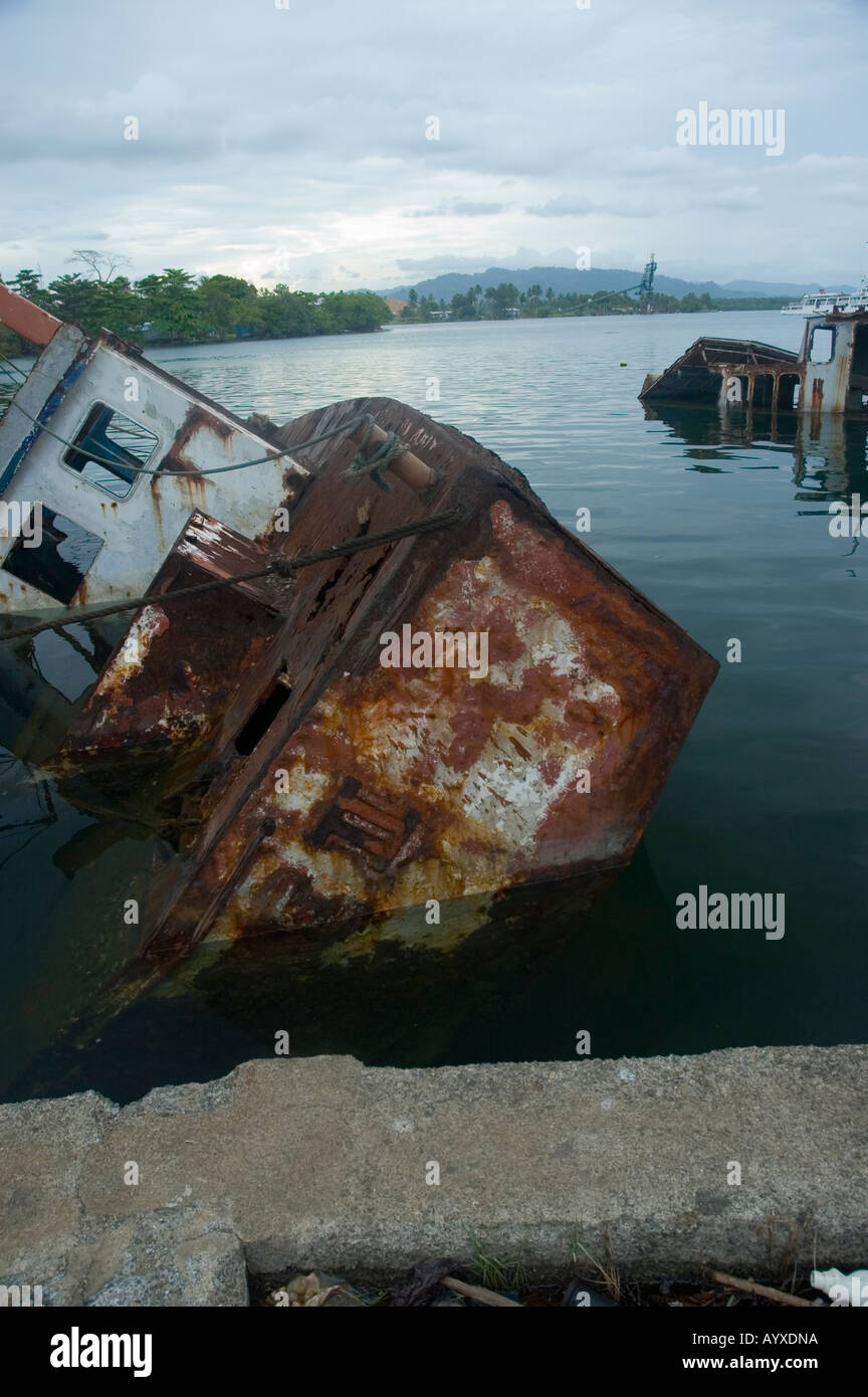 Sunken shipping madang Harbour PNG Papua New Guinea tropical cyclone damage Stock Photo