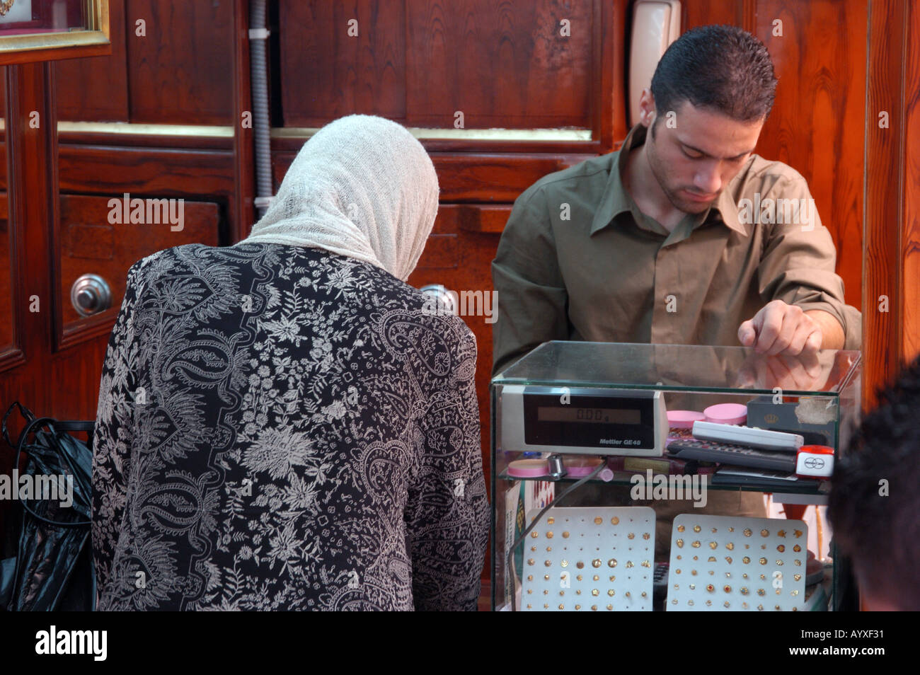 Jordanian woman buying gold jewelry in shop Amman Jordan Stock Photo Alamy