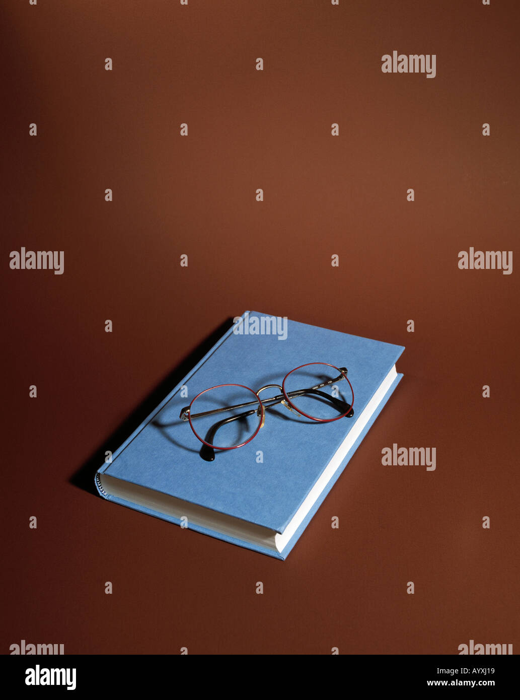 book, pair of spectacles Stock Photo