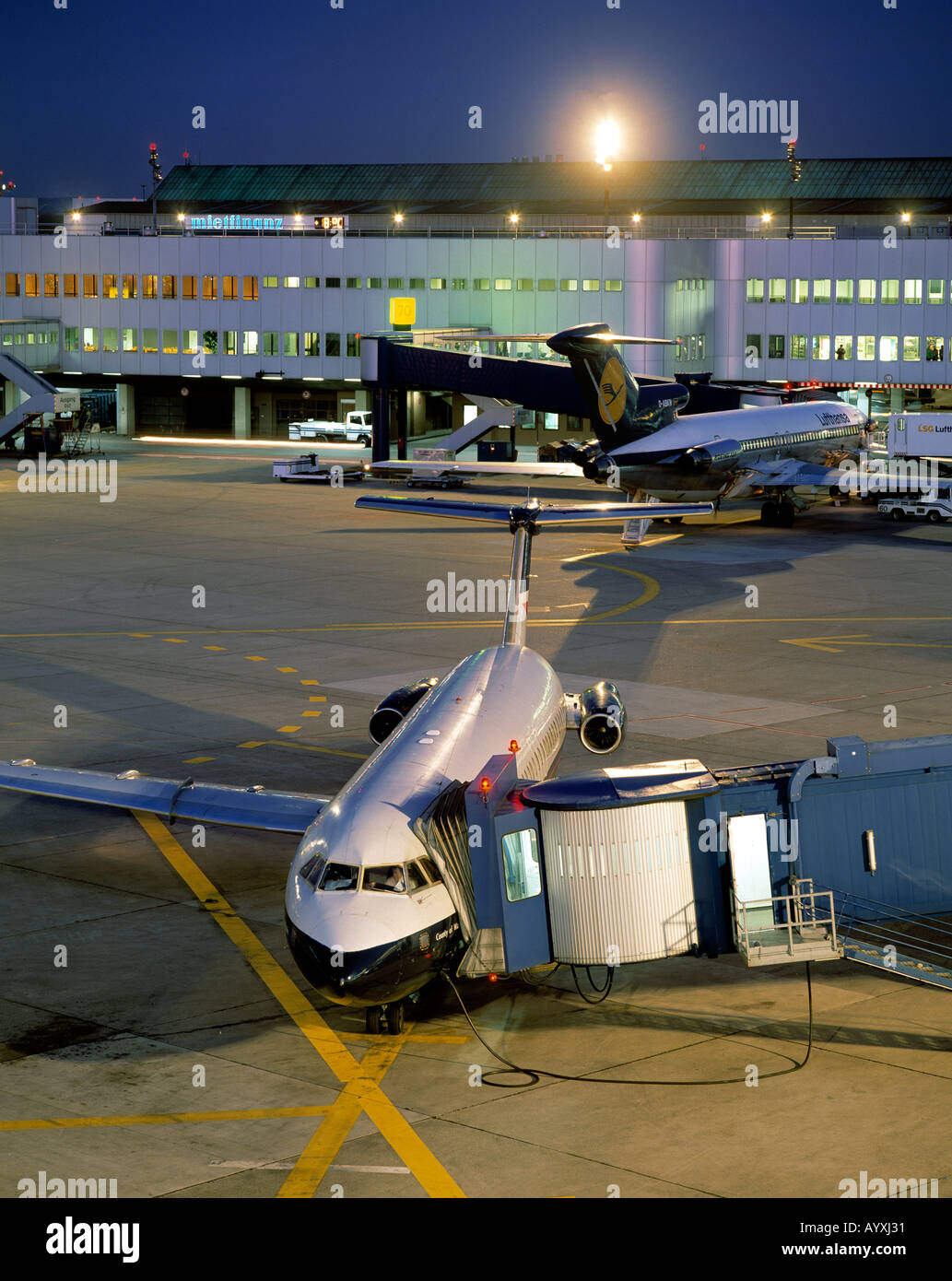 D-Duesseldorf, Rhine, North Rhine-Westphalia, airport, aeroplanes at terminals, evening mood, illuminated Stock Photo