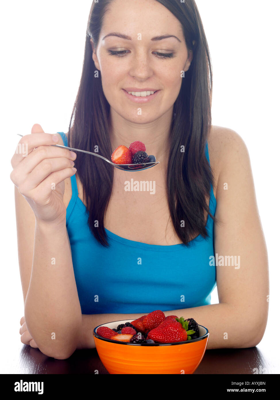 Young Woman Eating Mixed Berries Model Released Stock Photo Alamy
