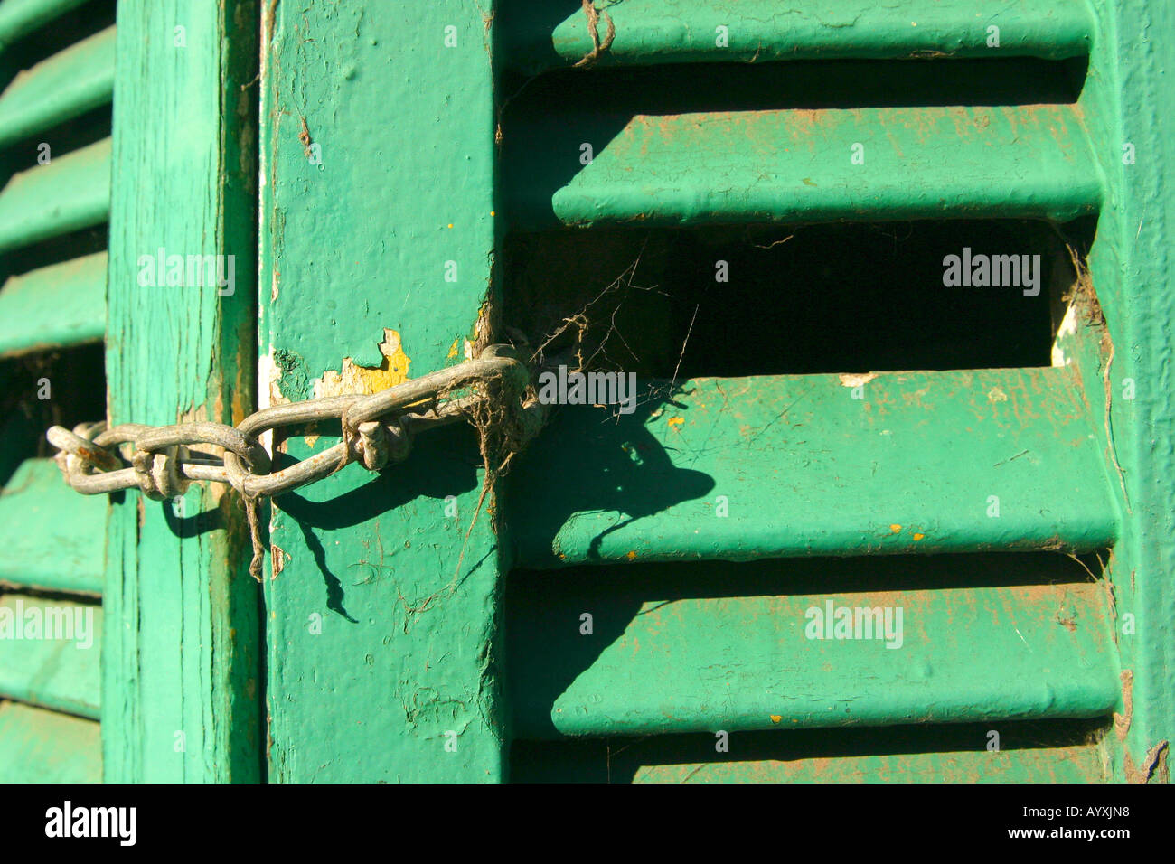 Window closed with a chain Stock Photo - Alamy
