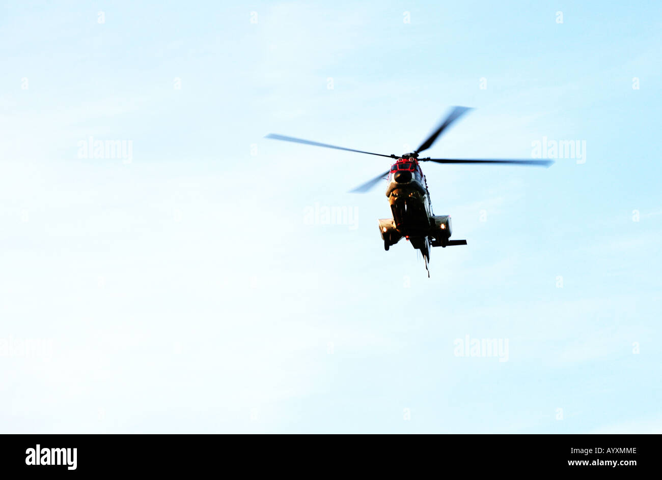 An image of a helicopter taken from underneath appraoching to land at Aberdeen Airport, Scotland Stock Photo