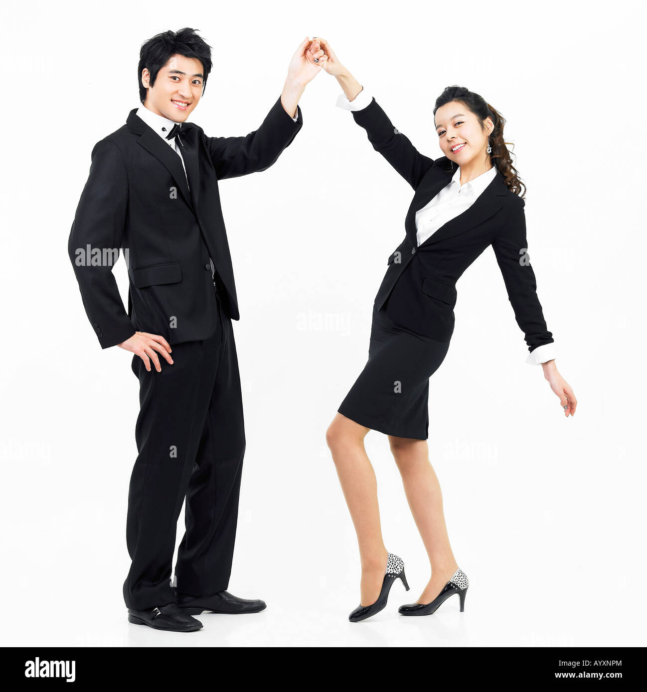 a couple in black suit dancing together Stock Photo Alamy