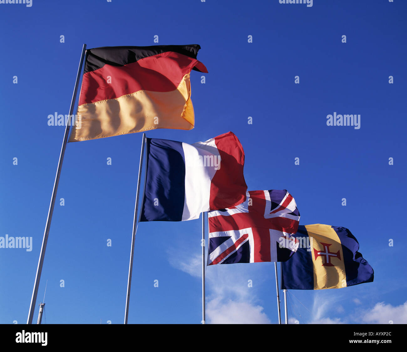 international flags, flags of different nations, German flag, flag of the Federal Republic of Germany, flag of France, French flag, flag of Great Britain, British flag, England, English flag, flag of Malta, Maltesian flag, flagpoles, blue sky, Stock Photo