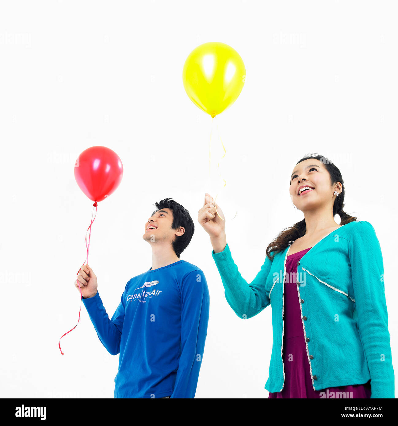 a couple holding balloons Stock Photo - Alamy