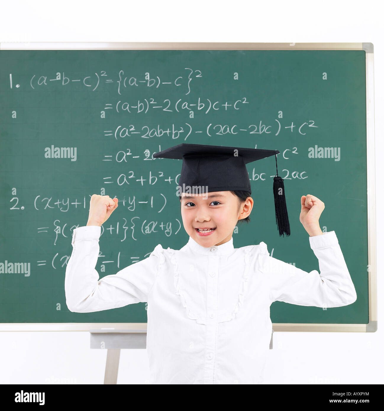 a girl wearing graduation hat in front of board Stock Photo Alamy
