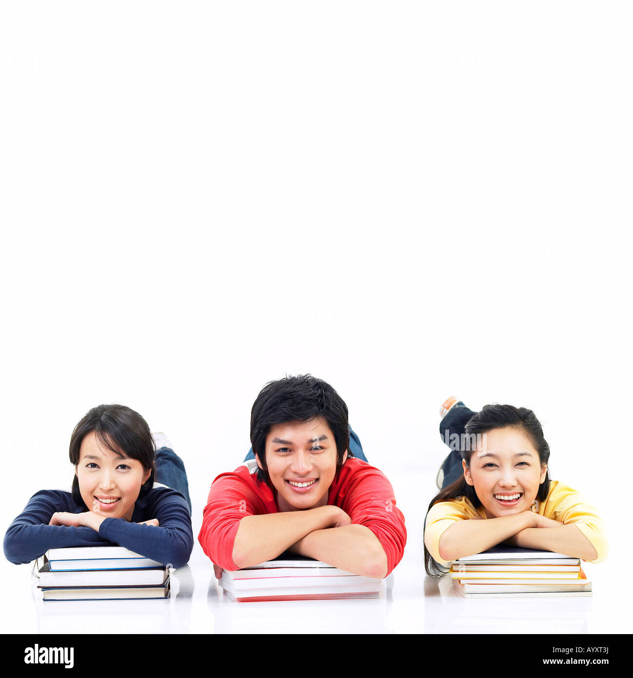 students laying down on the stack of books Stock Photo - Alamy