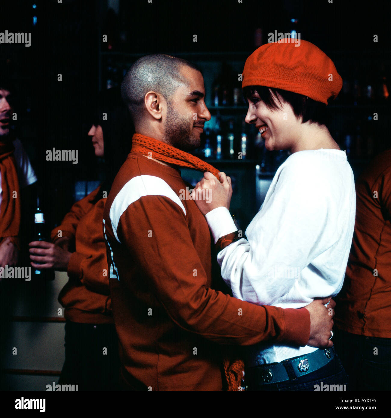 Team supporters embracing in sports bar Stock Photo Alamy