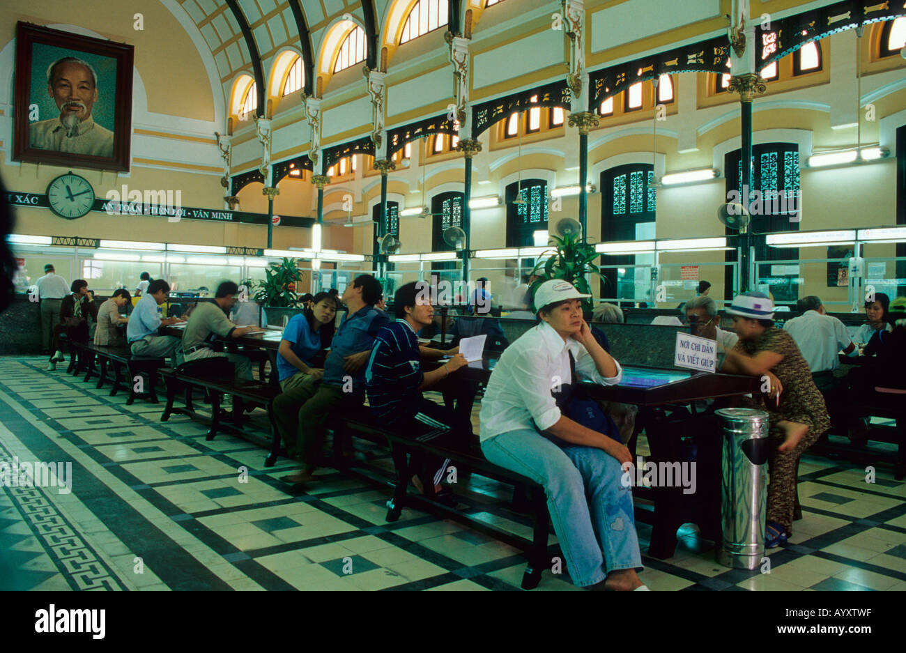 Ho Chi Minh City General Post Office,built between 1880-1891 by Gustave Eiffel, Ho Chi Minh portrait in background .Vietnam. Stock Photo
