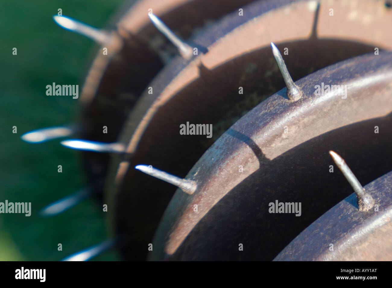 Old lawn aerator spiking Stock Photo
