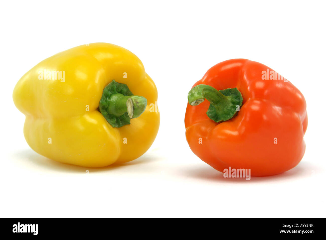 yellow and orange color peppe closeup isolated on white background food and vegetables concepts Stock Photo