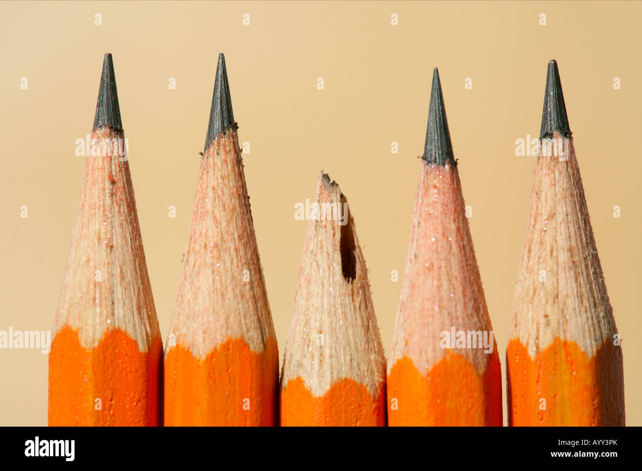 a-broken-pencil-between-sharpened-pencils-stock-photo-alamy