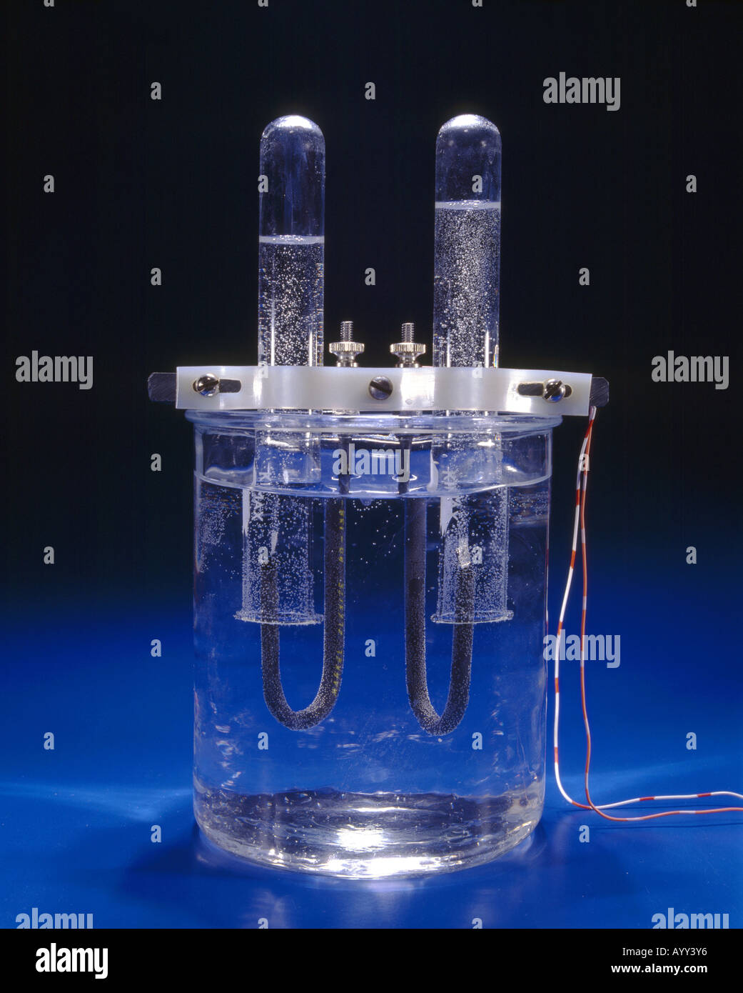 ELECTROLYSIS SEPARATION OF WATER USING DC CURRENT INTO 2 PARTS HYDROGEN AND 1 PART OXYGEN  STUDIO Stock Photo