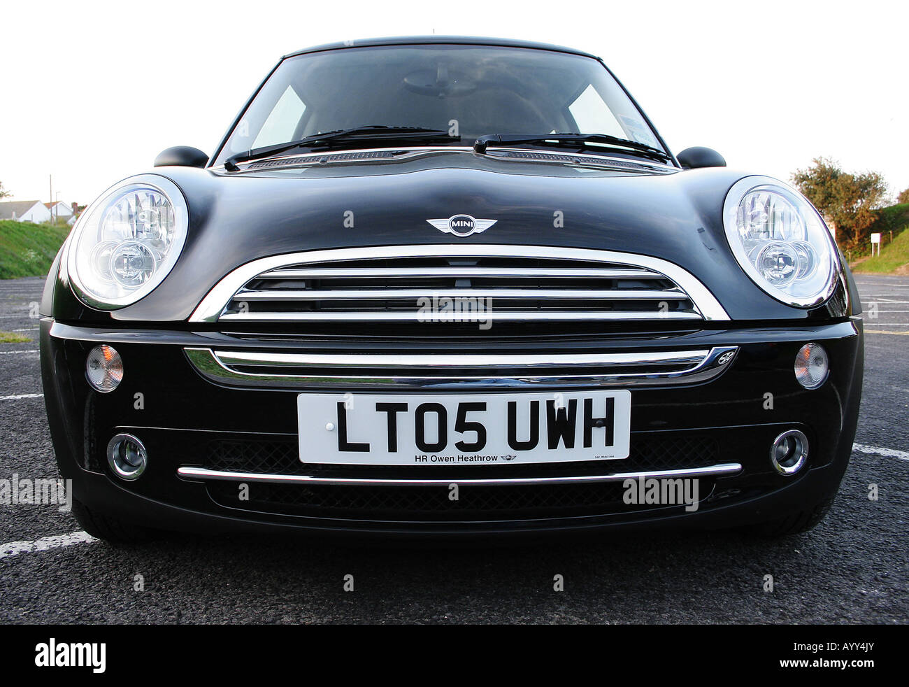 The front end of a black mini cooper. Stock Photo