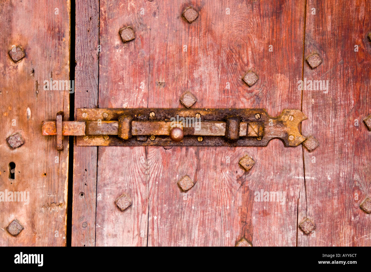 Bolt on antique brown door in the town of Bishops Waltham in Hampshire England Stock Photo