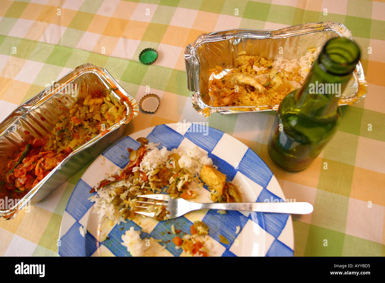 Takeaway Indian food carton and beer meal Stock Photo
